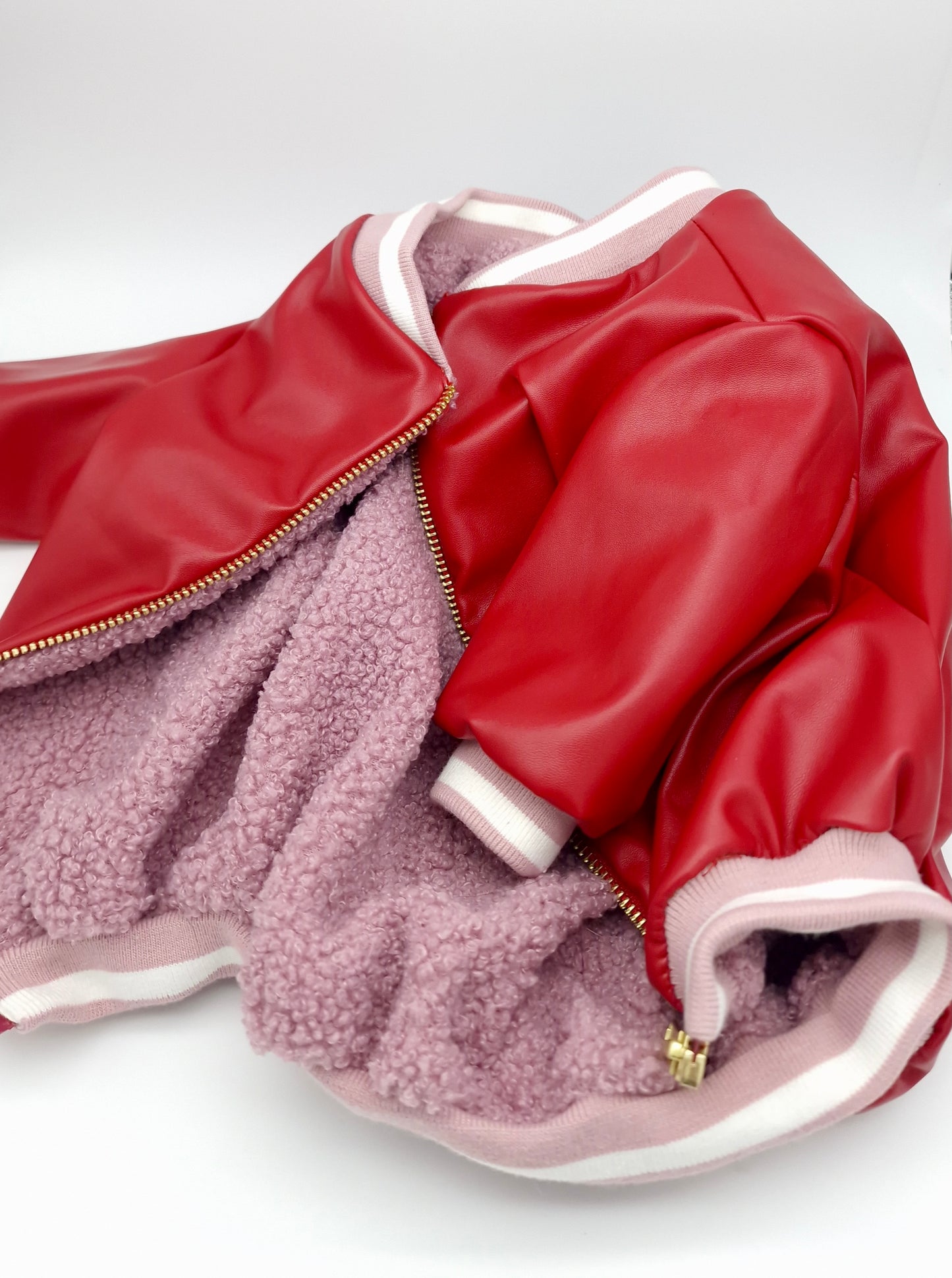 Red faux leather jacket with pink sherpa lining
